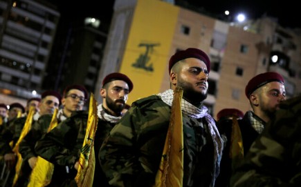 Hezbollah fighters stand in formation at a rally to mark Jerusalem Day or Al-Quds Day, in a southern suburb of Beirut, Lebanon, on May 31, 2019. (AP Photo/Hassan Ammar)
