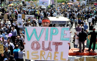 An Iranian protester holds an anti-Israeli placard during an annual anti-Israeli Al-Quds Day rally in Tehran, Iran, June 8, 2018. (AP Photo/Ebrahim Noroozi/File)